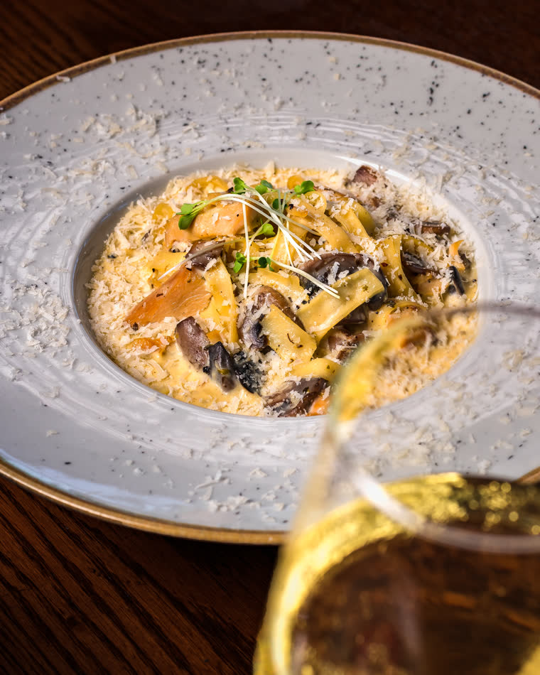 Creamy mushroom pasta with shaved parmesan and white wine